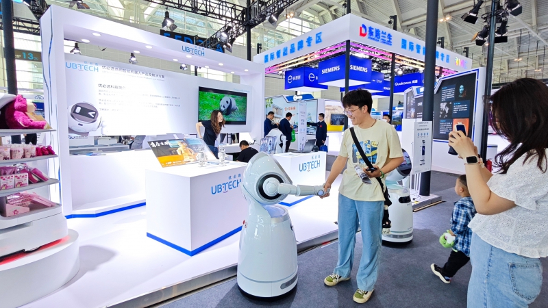 Audience interacts with the commercial service robot Cruzr